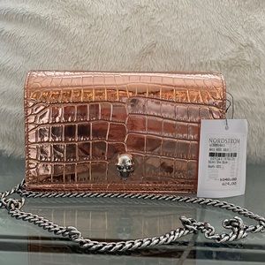 Small rose gold Alexander McQueen purse